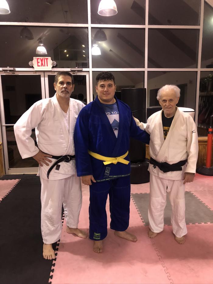 AJ Germani promoted to Yellow belt with Sensei Tim Krulan