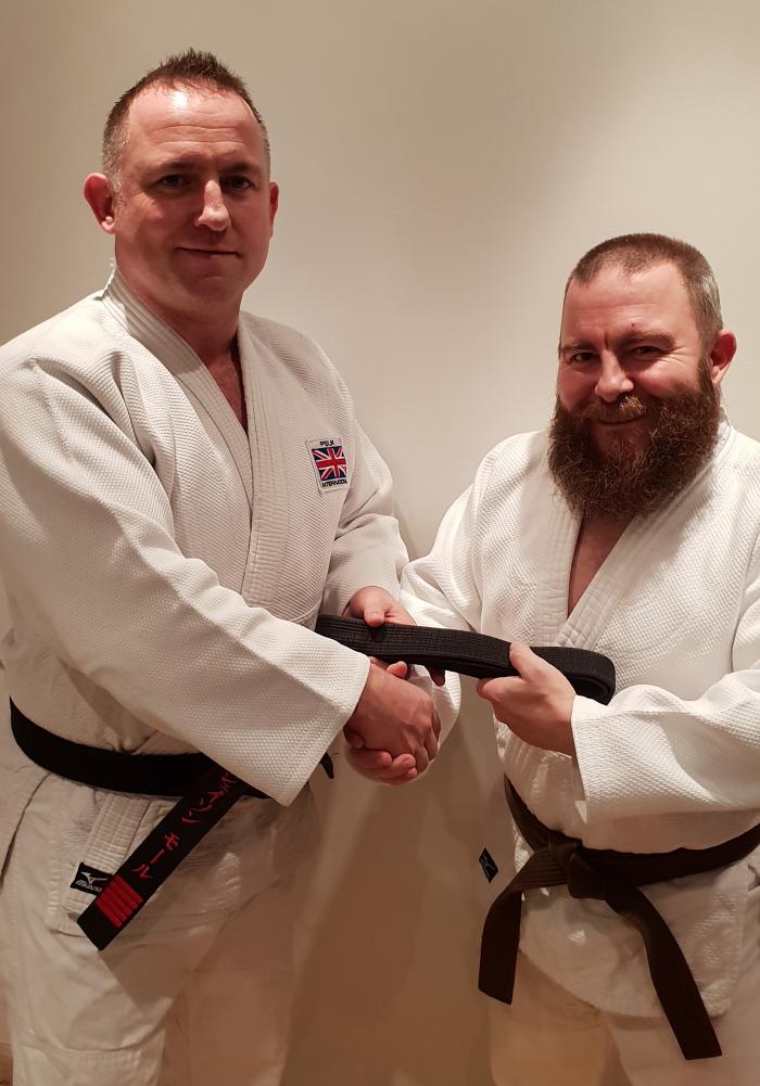Recieving my 1st Dan from my instructor (and brother) Jason Moore 6th Dan.
